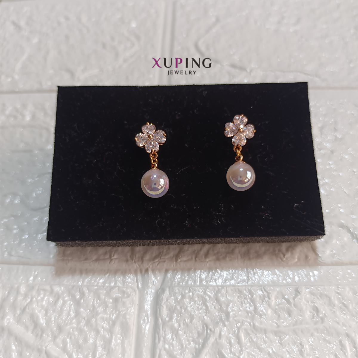 arete con perla y flor